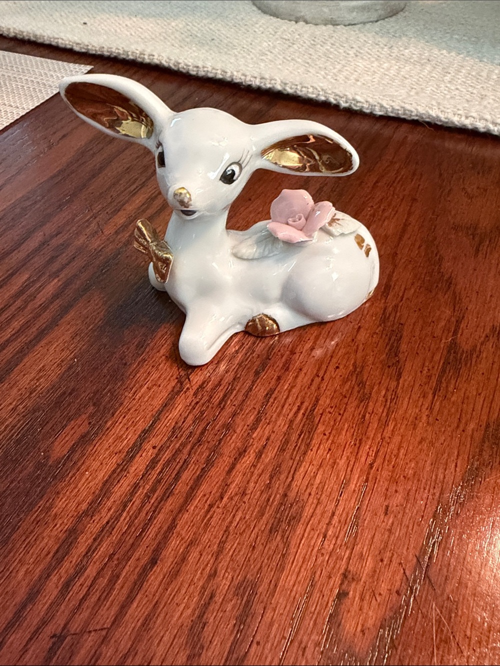 White Porcelain Deer Figurine with Pink Flower and Gold Accents